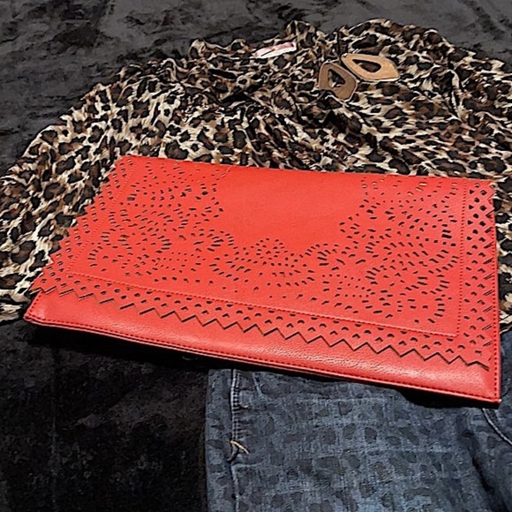 Large brick red laser-cut fold-over clutch